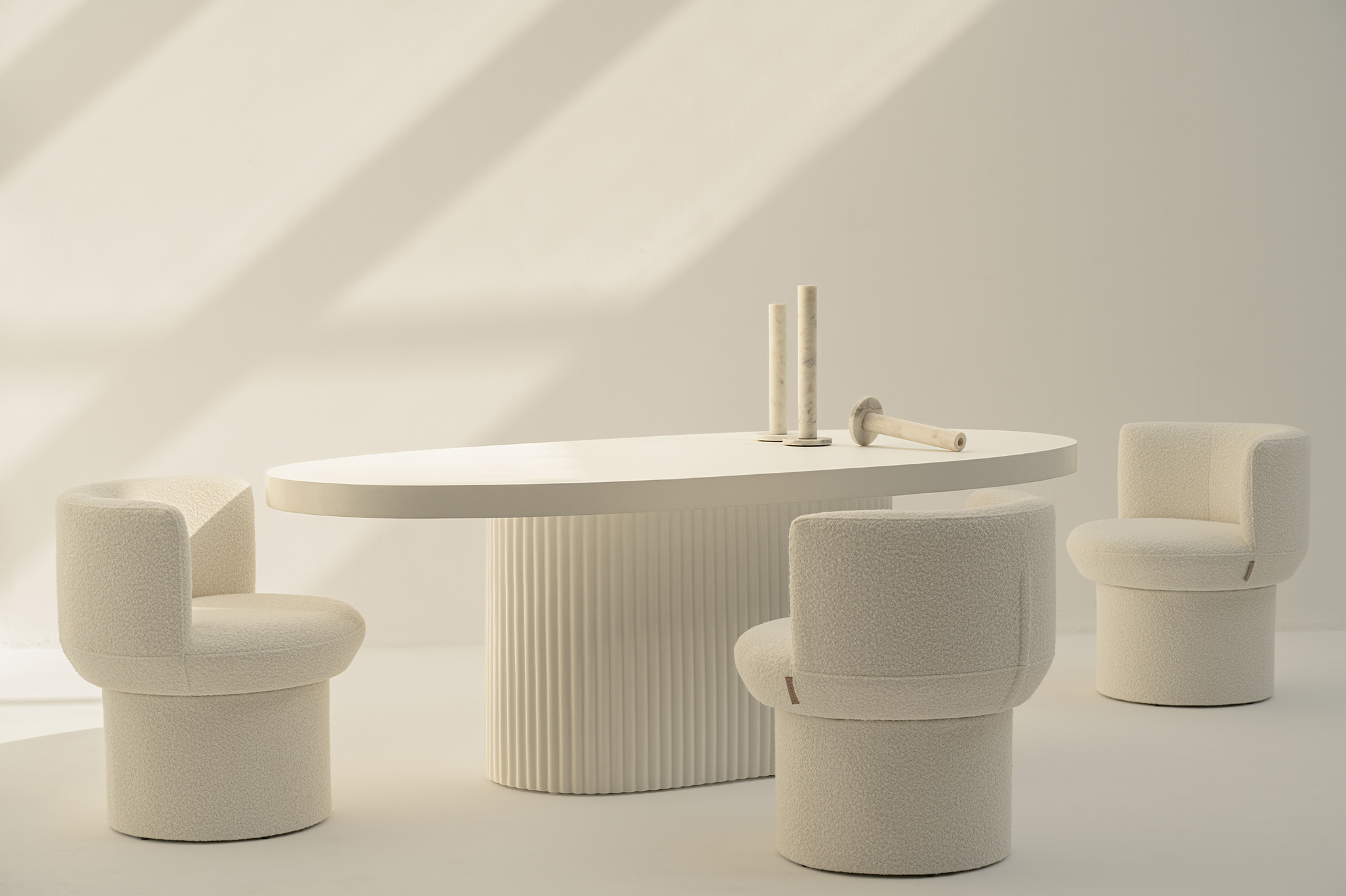 This dining group feels effortlessly refined, like a modern echo of ancient architecture